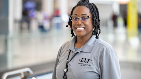 A CLT Airport Operations Security team member, Terasia Arrington, ensures a safe and welcoming travel experience.