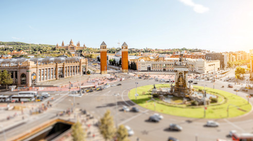 Plaza de España in Barcelona with traffic and towers
